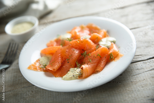 Traditional smoked salmon with dill sauce