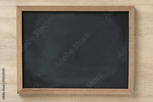 Blackboard on a wood background