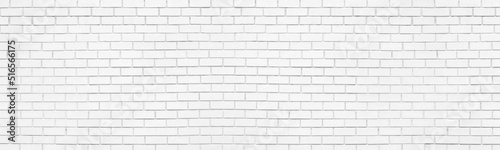 White painted old exterior brick wall. Whitewashed brickwork wide texture. Abstract light grunge vintage background