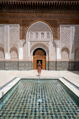 Woman standing in the Ali Ibn Yusuf mosque and madrasah © Witold