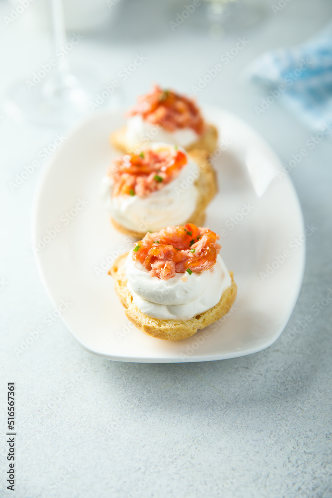 Homemade profiteroles with salmon and cream cheese