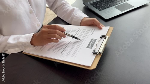 Person submitting resume to interview for a job with a company, Person attending a job interview with a manager to be recruited to the company for the position applied for. Job application concept.