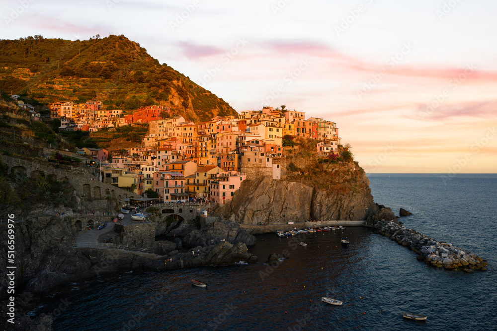Stunning view of Manarola, the second village of the Cinque Terre coming from La Spezia. Manarola is the most picturesque village, made up of colorful tower-houses. La Soezia, Liguria, Italy.
