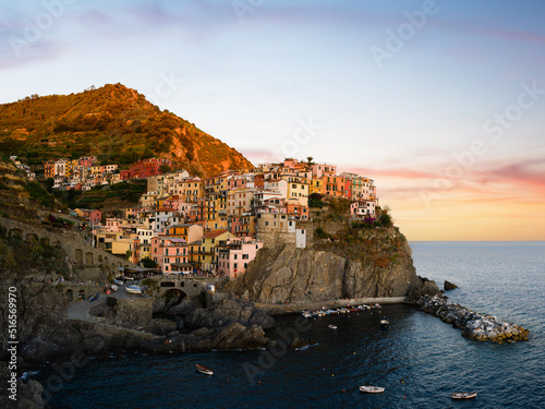 Stunning view of Manarola, the second village of the Cinque Terre coming from La Spezia. Manarola is the most picturesque village, made up of colorful tower-houses. La Soezia, Liguria, Italy.