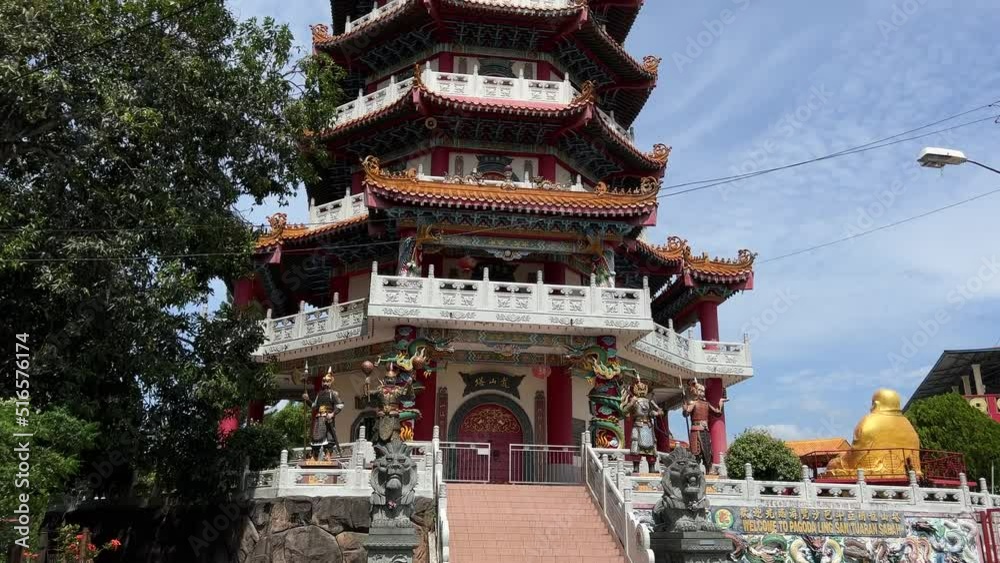 Tuaran, July 11, 2022 - A Buddhist temple stands upright and high. Famous temple in Tuaran. Video taken up close. Tuaran, July 11, 2022 - A Buddhist temple stands upright and high. Famous temple in Tuaran. Video taken up close.