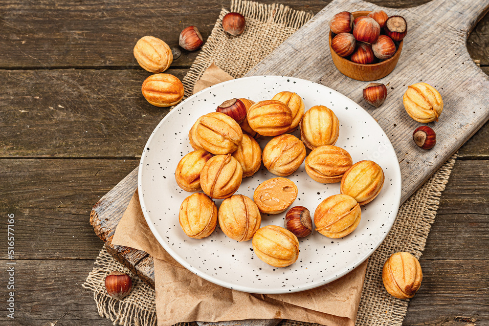 Cookies in the shape of walnuts with condensed milk cream filling.Delicious shortbread sandwiches Cookies in the shape of walnuts with condensed milk cream filling.Delicious shortbread sandwiches