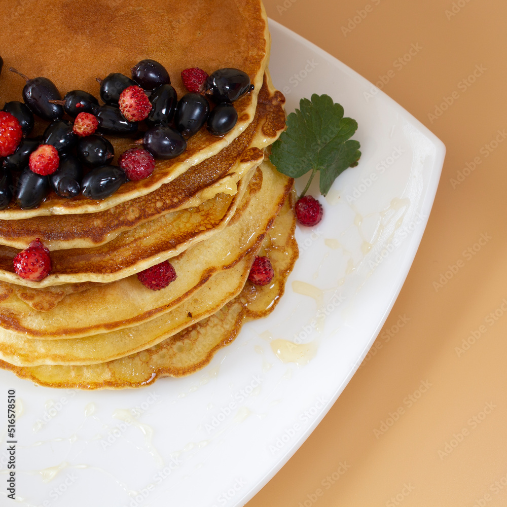 pancakes, pancakes with berries on a colored background pancakes, pancakes with berries on a colored background