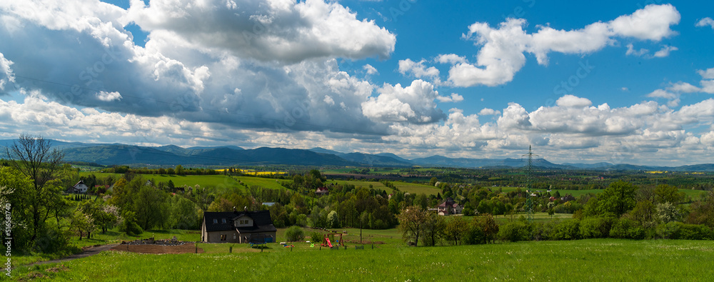 Obraz premium Rural landscape and Moravskoslezske Beskydy mountains from view point bellow Babi hora hill in Czech republic