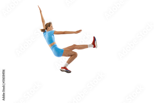 Triple jump technique. Studio shot of female athlete in sports uniform jumping isolated on white background. Concept of sport, action, motion, speed.