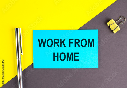 WORK FROM HOME text written on sticky with pen on grey, yellow background, business concept photo