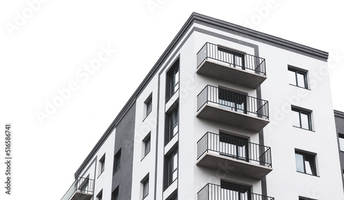 Modern apartment building with balcony isolated on white background