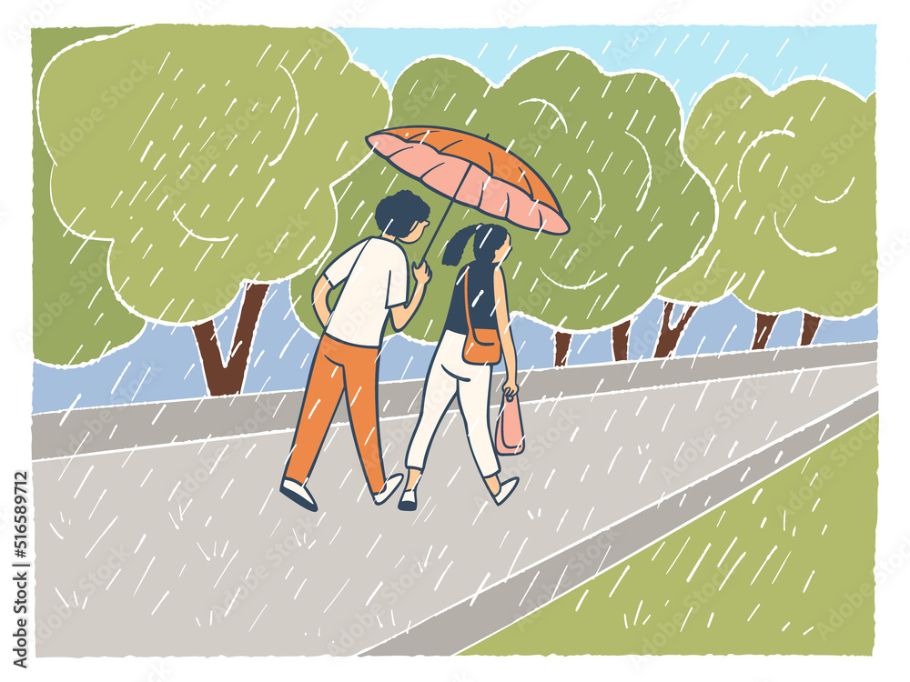 Obraz premium A young couple walking in the rain with an umbrella.