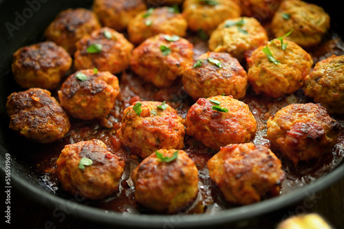 Closeup Meatballs and Tomato Sauce in Pan