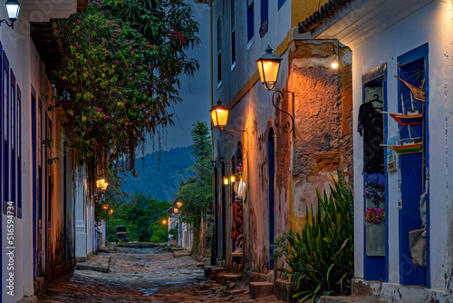 Bucolic street in the city of Paraty in the state of Rio de Janeiro with its colonial-style houses and cobblestones at dusk. photo