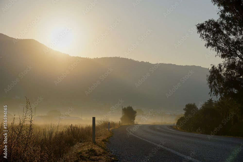 Empty countryside road at sunrise