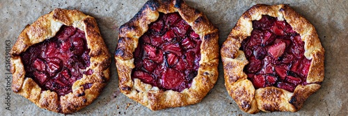 French dessert Galette with shortbread and strawberries. Open pie with berries. Banner. photo