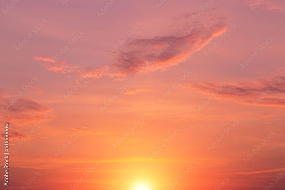 Beautiful sunrise, sunset pink yellow orange sky with sun and sunlight abstract background texture