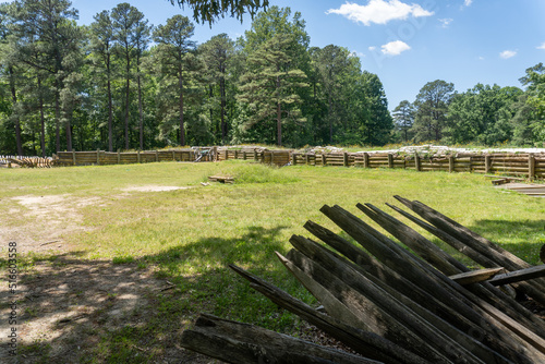 Petersburg, Virginia -2022: Petersburg National Battlefield site of American Civil War Siege of Petersburg. Cannon aimed out of log fort. Recreations of camp buildings and field fortifications.