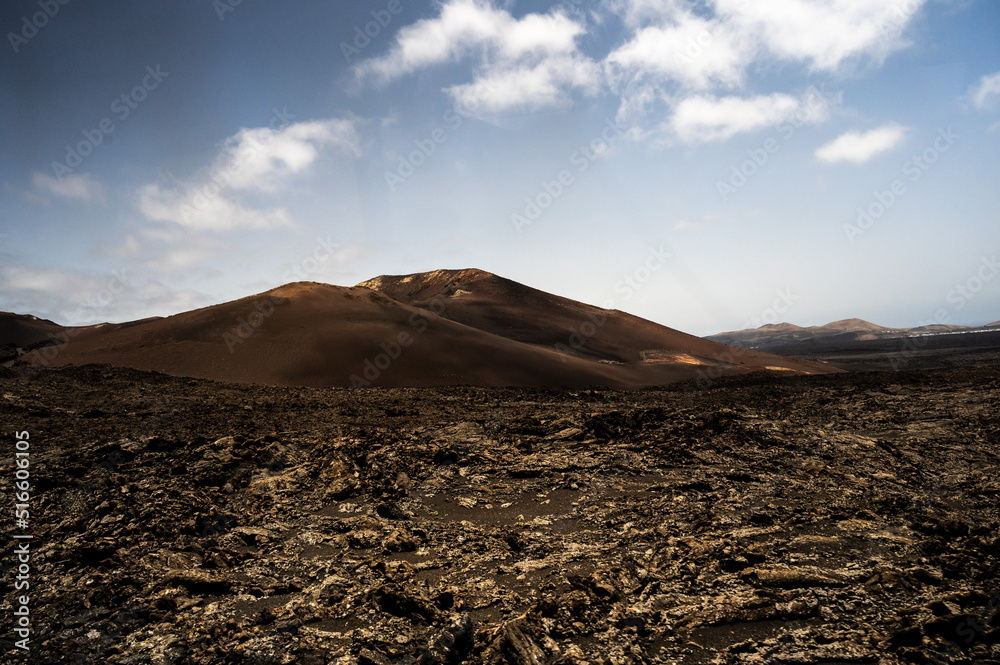 View of a volcano crater in Timanfaya National Park, a protected volcanic area located  in the south west coast of Lanzarote, Canary Islands, Spain.
