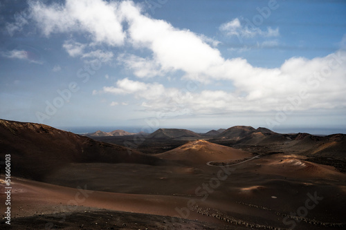 View of a volcano craters in Timanfaya National Park, a protected volcanic area located in the south west coast of Lanzarote, Canary Islands, Spain.
