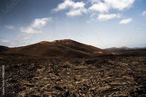 View of a volcano crater in Timanfaya National Park, a protected volcanic area located in the south west coast of Lanzarote, Canary Islands, Spain.