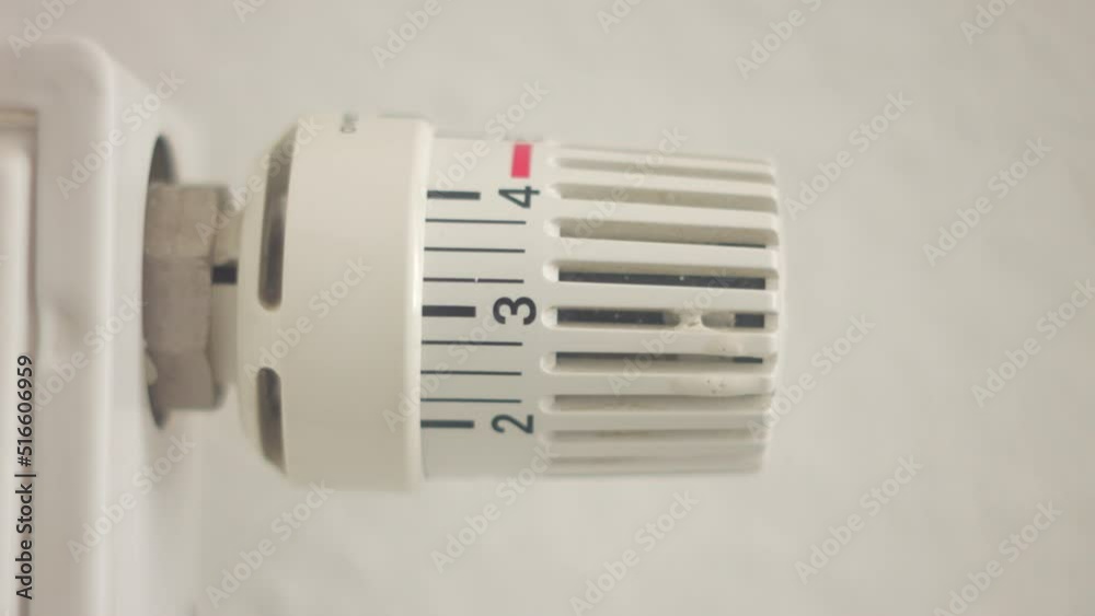 hand turns the heating system thermostat. 4K video hand turns the heating system thermostat. 4K video