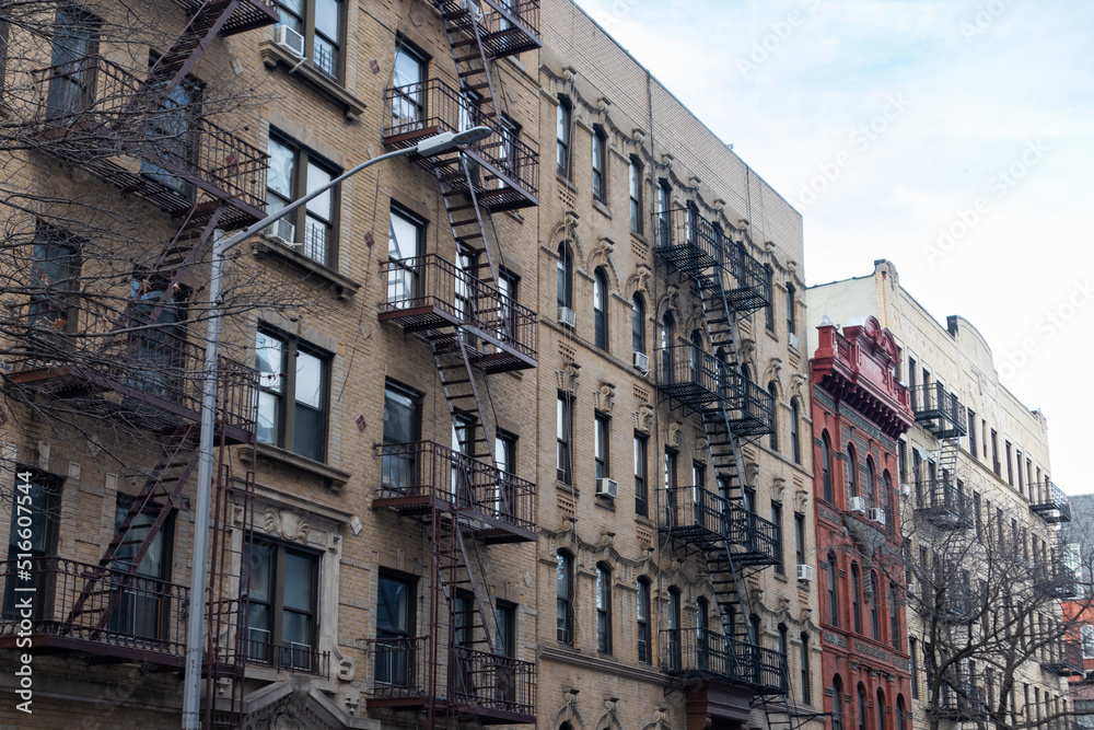 Row of Old Brick Residential Buildings with Fire Escapes in Williamsburg Brooklyn of New York City