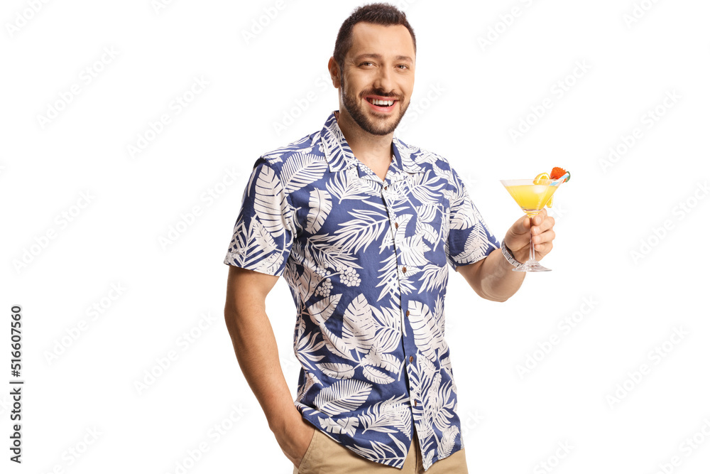 Smiling young man holding a cocktail Smiling young man holding a cocktail