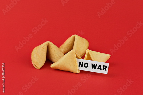 Chinese fortune cookies on red background with inscription NO WAR. Call for peace and an end to the war photo