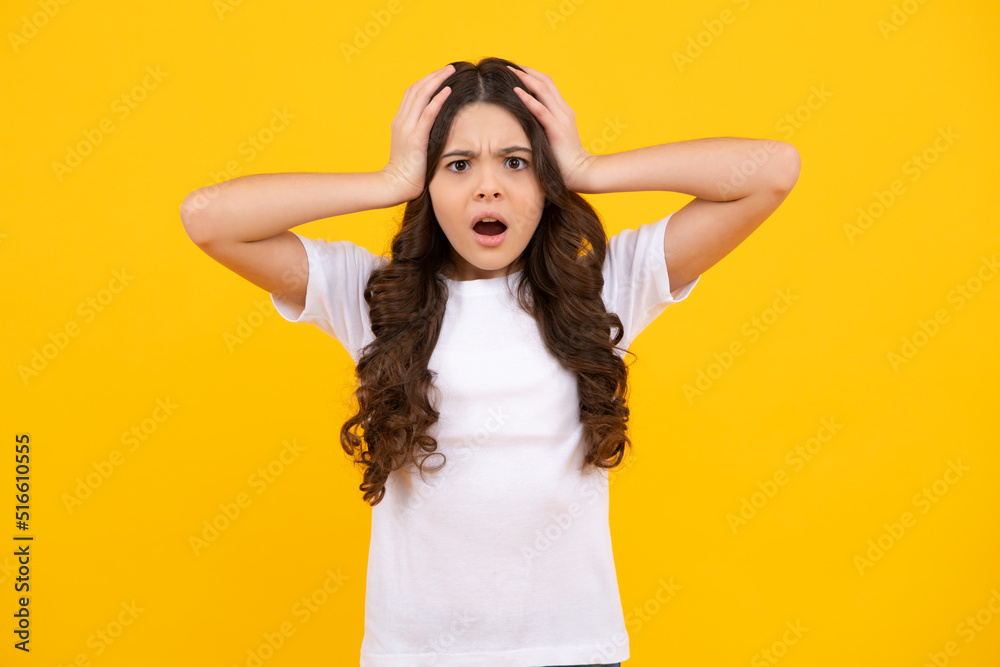 Portrait of angry teen girl looking at camera isolated on studio background. Unhappy upset teenager child. Portrait of angry teen girl looking at camera isolated on studio background. Unhappy upset teenager child.