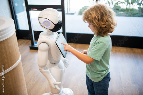 фотографія curious kid interact with robot artificial intelligence, communication