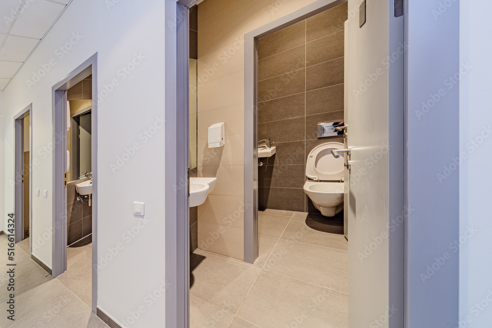 Toilet room in the office center. Restroom interior Toilet room in the office center. Restroom interior