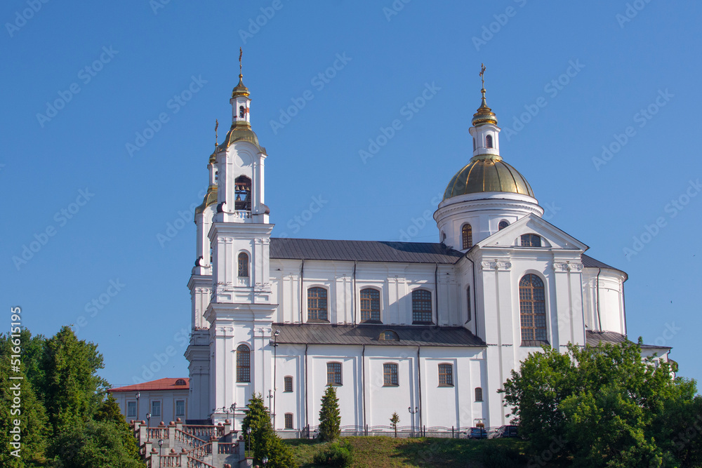 Vitebsk, Belarus - June 26, 2022 : Holy Assumption Cathedral of the Assumption on the hill and the Holy Spirit convent and Western Dvina River