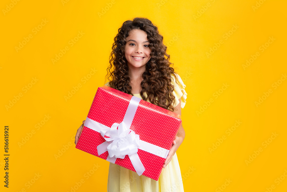 Happy teenager portrait. Teenager kid with present box. Teen girl giving birthday gift. Present, greeting and gifting concept. Smiling girl. Happy teenager portrait. Teenager kid with present box. Teen girl giving birthday gift. Present, greeting and gifting concept. Smiling girl.