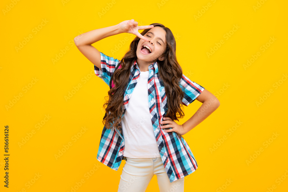 Funny portrait of amazed teenager child girl isolated on yellow background. Funny portrait of amazed teenager child girl isolated on yellow background.