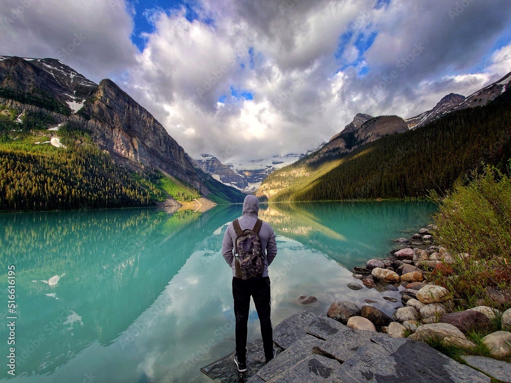 Man looking at Lake Louise in Banff National Park Alberta Canada