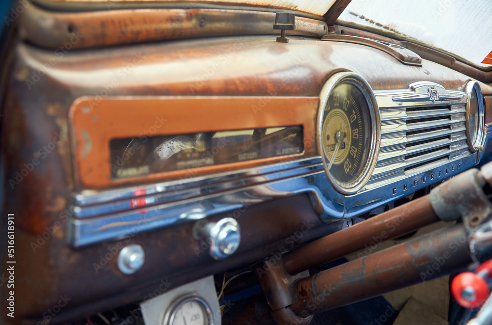 Fototapeta premium Dashboard in an old truck close-up. Speedometer and gauges