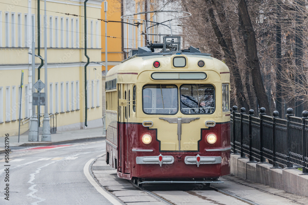 Vintage tram on the town street in the historical city center.