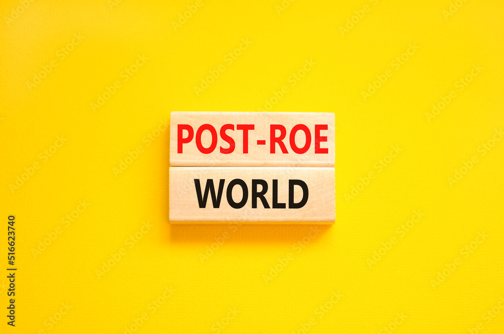 Roe vs Wade post-Roe world symbol. Concept words Post-Roe world on wooden blocks on a beautiful yellow table yellow background. Business and Roe vs Wade post-Roe world concept. Copy space. Roe vs Wade post-Roe world symbol. Concept words Post-Roe world on wooden blocks on a beautiful yellow table yellow background. Business and Roe vs Wade post-Roe world concept. Copy space.