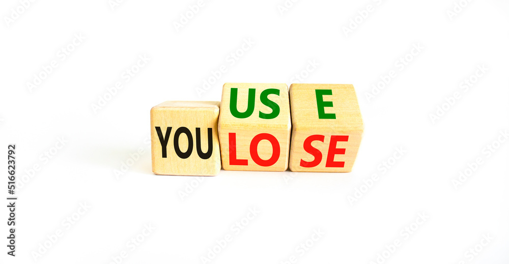 You use or lose it symbol. Concept words You use and You lose on wooden cubes. Beautiful white table white background. Business and you use or lose it concept. Copy space. You use or lose it symbol. Concept words You use and You lose on wooden cubes. Beautiful white table white background. Business and you use or lose it concept. Copy space.