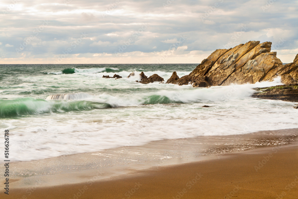 Sunset at Azkorri beach in the coast of Biscay, Basque Country, north of Spain. 