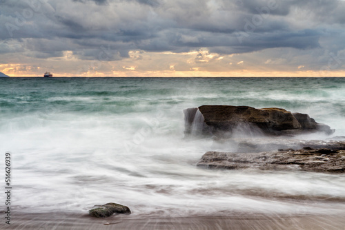 Sunset at Azkorri beach in the coast of Biscay, Basque Country, north of Spain. 