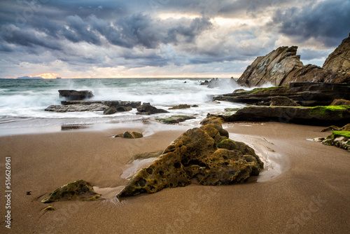 Sunset at Azkorri beach in the coast of Biscay, Basque Country, north of Spain.  photo