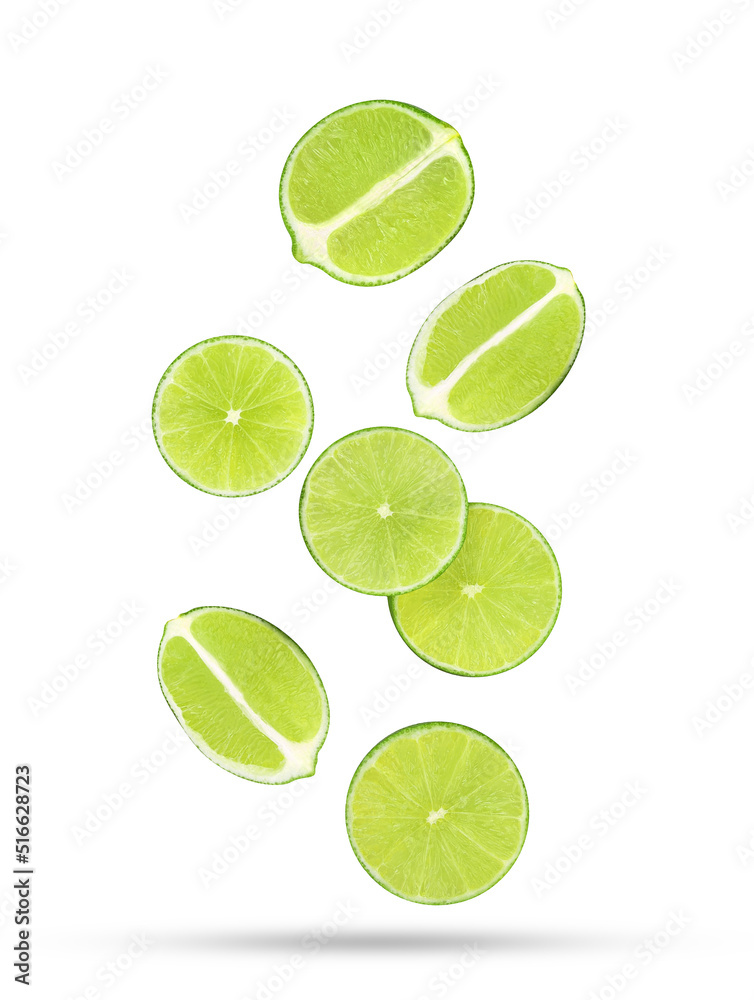 Sliced fresh lime fruit falling in the air isolated on white background.