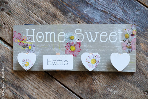Home sweet home on wooden table