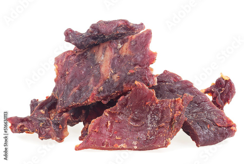 Beef jerky pieces isolated on a white background. Spices beef cured.