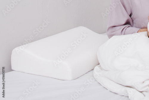 Orthopedic Pillow with a Memory Effect. Medical treatment pillow for sleep. Comfort Memory Pillow under the head with a recess under the shoulder isolated on white background. Sleeping Support Pillow.