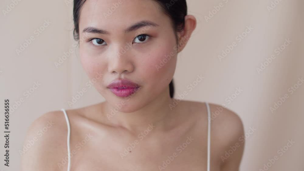 Beautiful Asian Woman With Posing In Studio.
Beautiful Asian Woman With Posing In Studio.