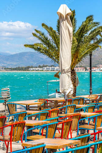 Fototapeta Naklejka Na Ścianę i Meble -  Promenade with palm trees in Nafplio, Greece