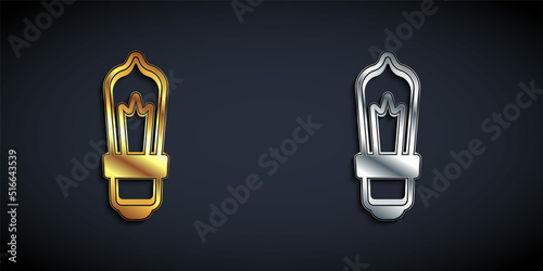 Gold and silver Light bulb with concept of idea icon isolated on black background. Energy and idea symbol. Inspiration concept. Long shadow style. Vector